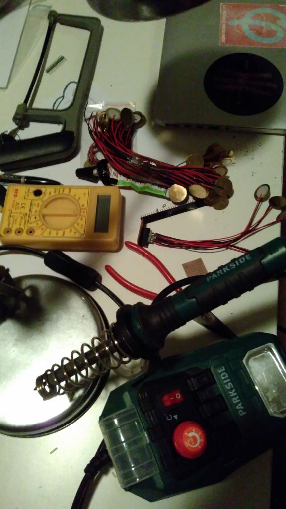 different tools and multimeter while working on the first prototype electric vibraphone